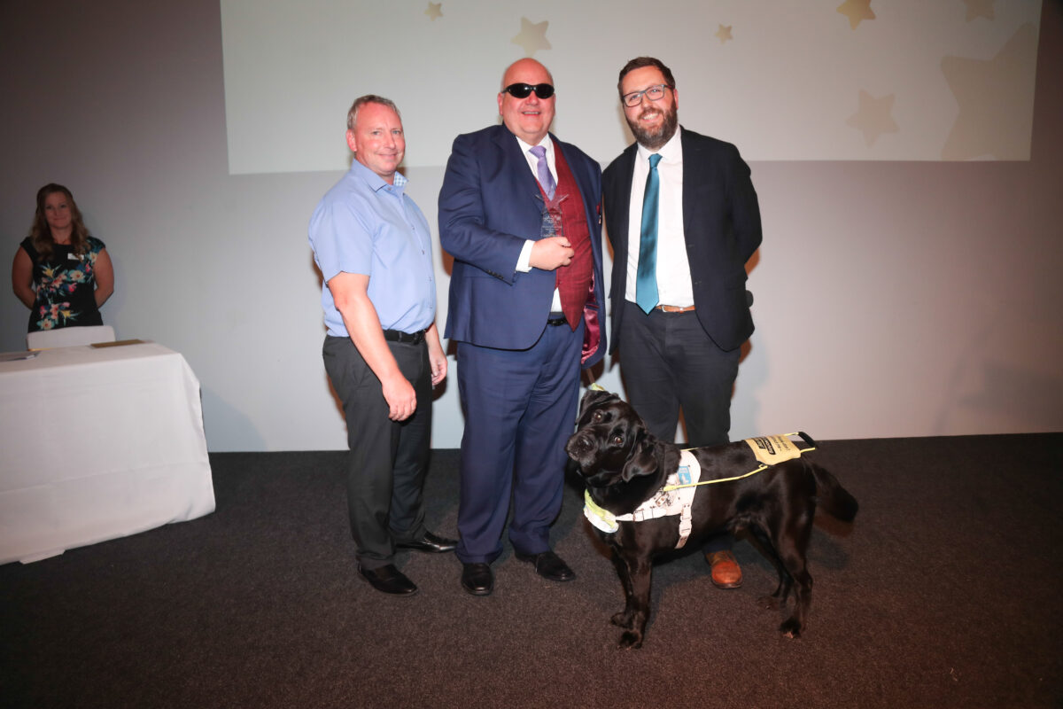 Ben McGrail, ITV newsreader, with winners of the Star Awards