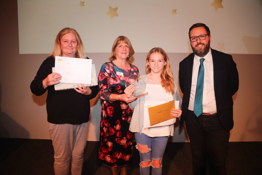 Young Hero of The Year Award Winners posing for a picture on stage at the Star Awards 2022