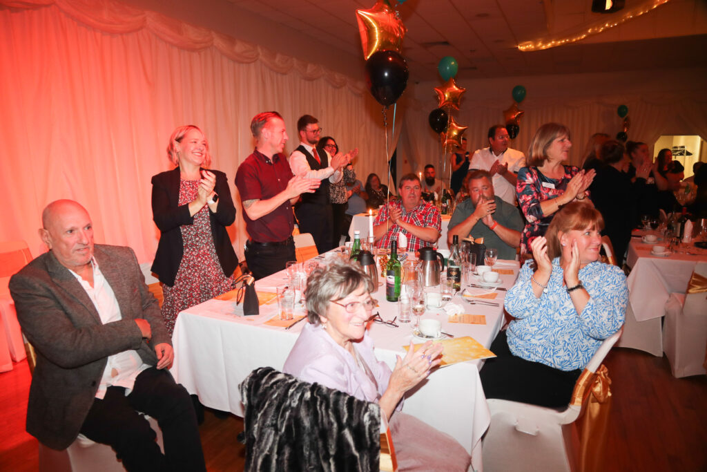 People giving a standing ovation to The Star of The Year Award Winner at the Star Awards 2022